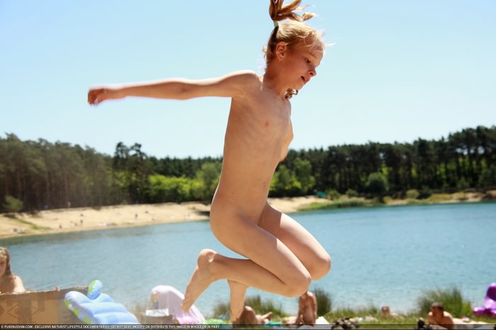 Weekend with nudists in the summer on the lake photo